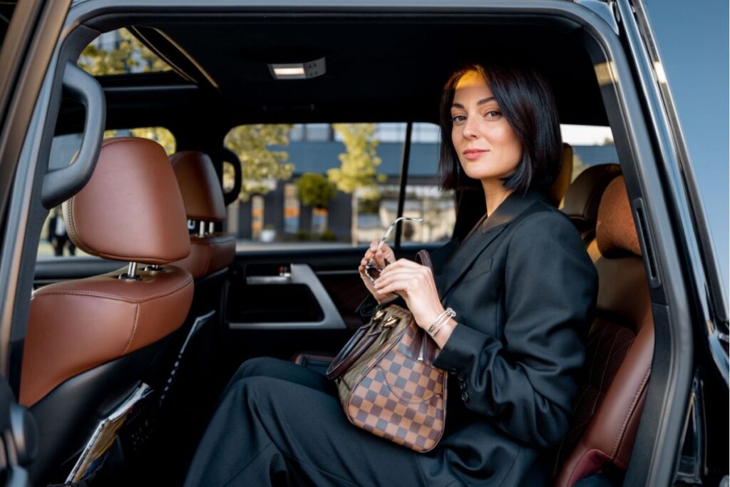elegant woman using private car service
