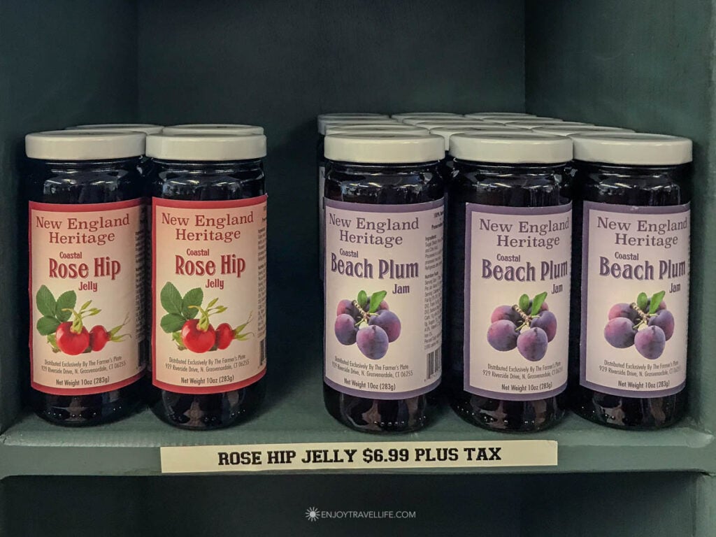 Beach plum jam and rose hip jelly on store shelves.