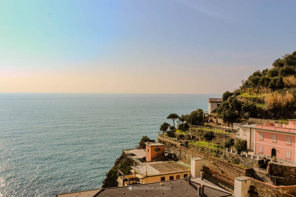Golden afternoon light on the rooftops of Riomaggiore, looking out over the Tyrrhenian Sea.