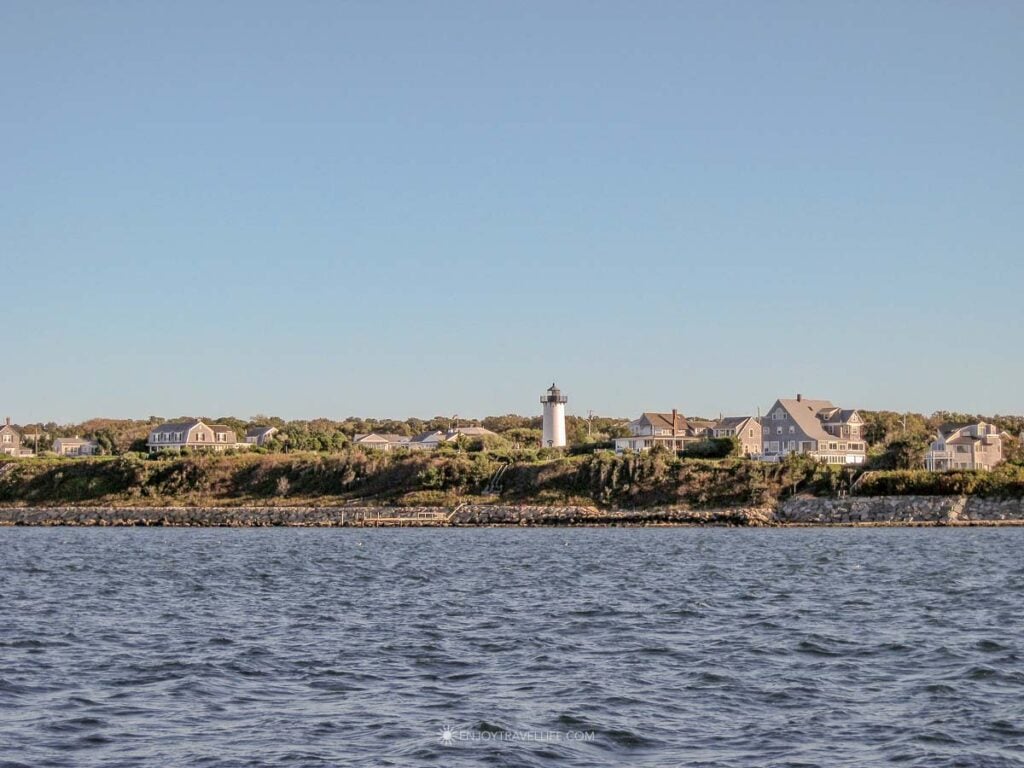 East Chop Lighthouse surrounded by shingled homes on a bluff overlooking Vineyard Sound