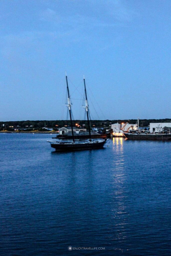 Two-masted schooner anchored in a Martha's Vineyard harbor at dusk