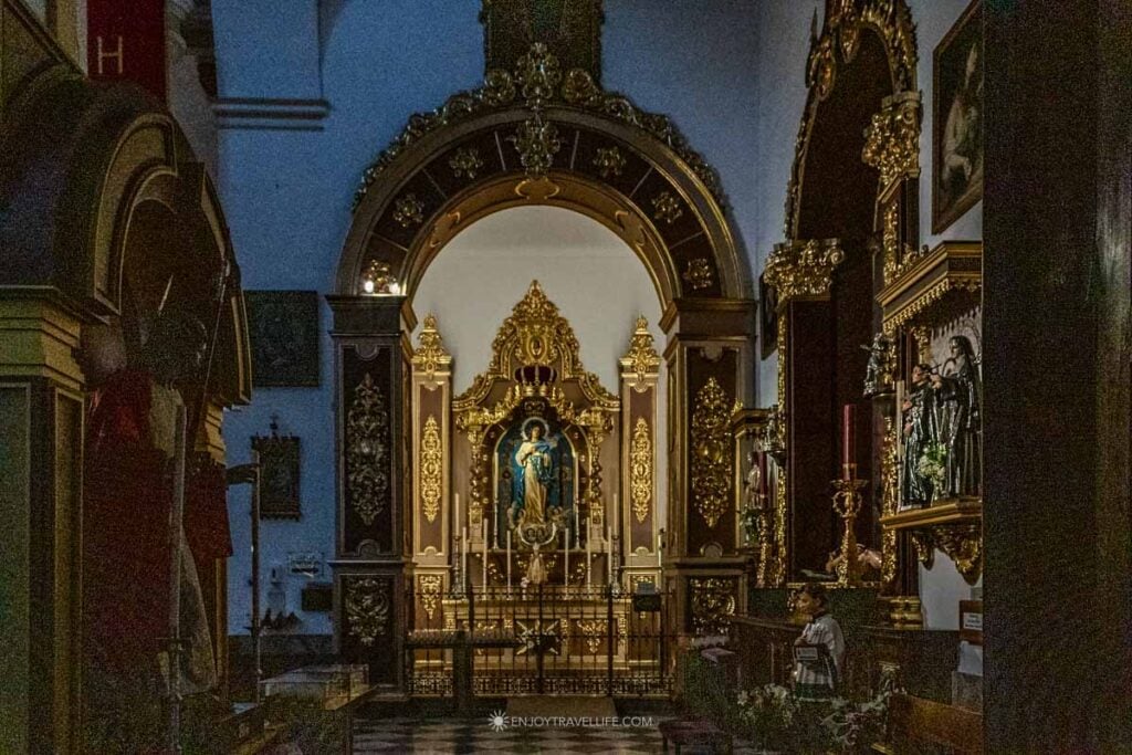 Ornate gold altar inside the Iglesia de la Encarnación in Marbella's Old Town, Spain
