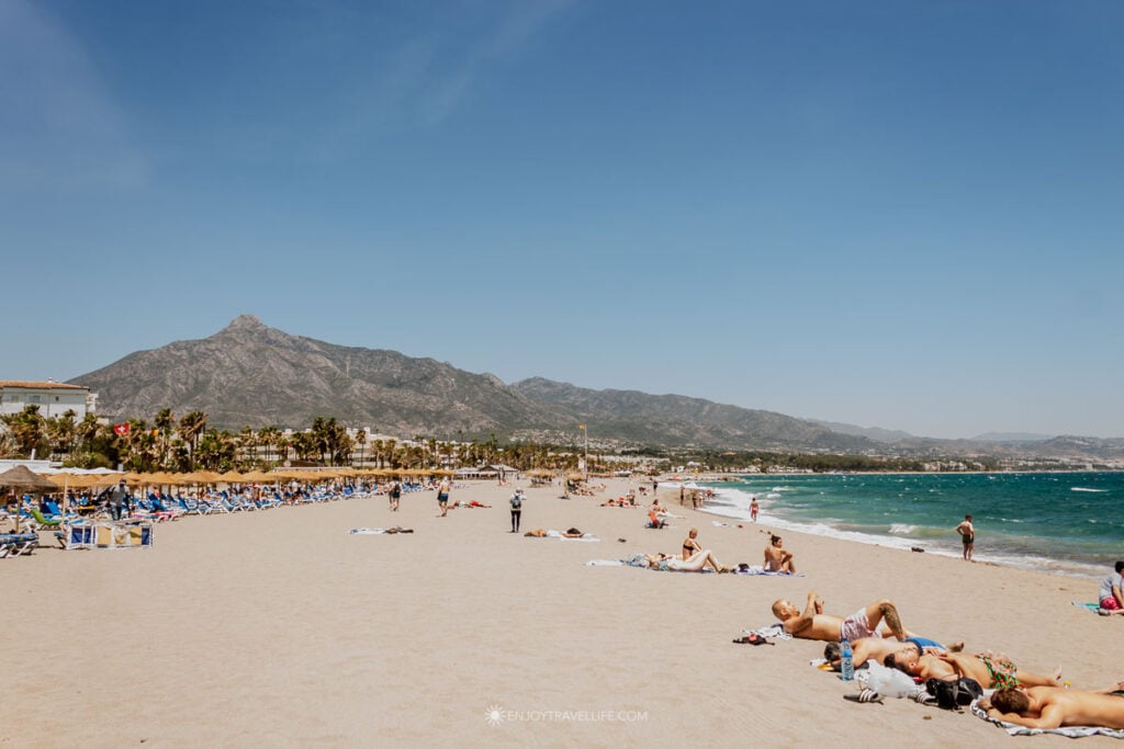 Puerto banus beach with la concha backdrop