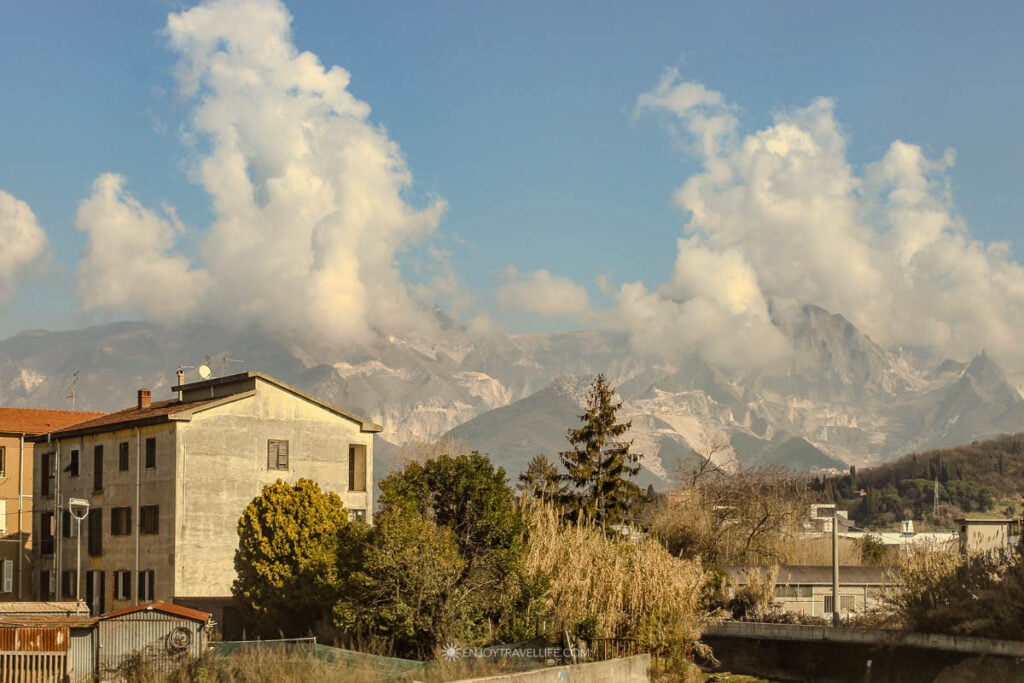 Carrara marble quarries in the Apuan Alps seen from the train window on the route from Florence to Cinque Terre