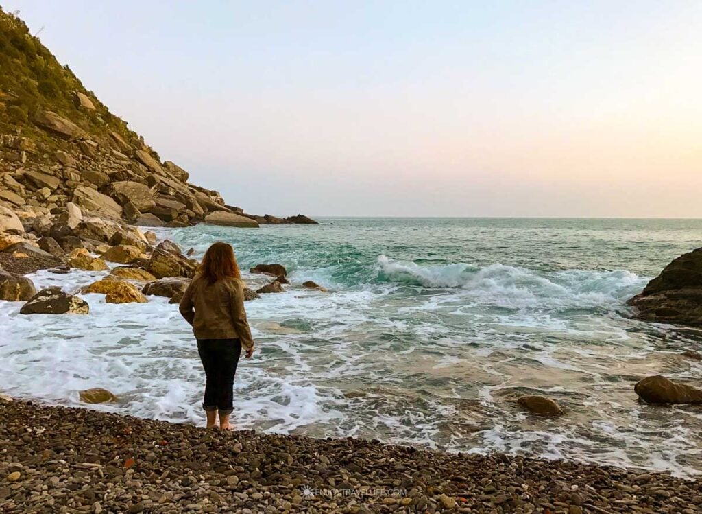 Jackie Gately dipping her toes in the Tyrrhenian Sea at the pebble beach in Riomaggiore, Cinque Terre in February.