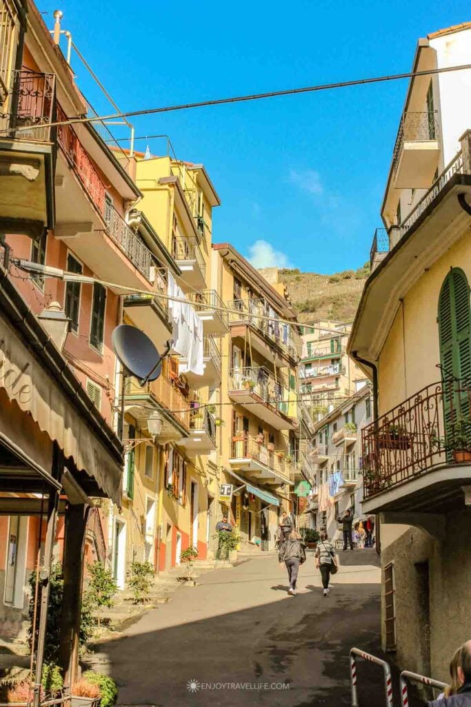 Colorful facades and balconies on Via Colombo in Riomaggiore Cinque Terre