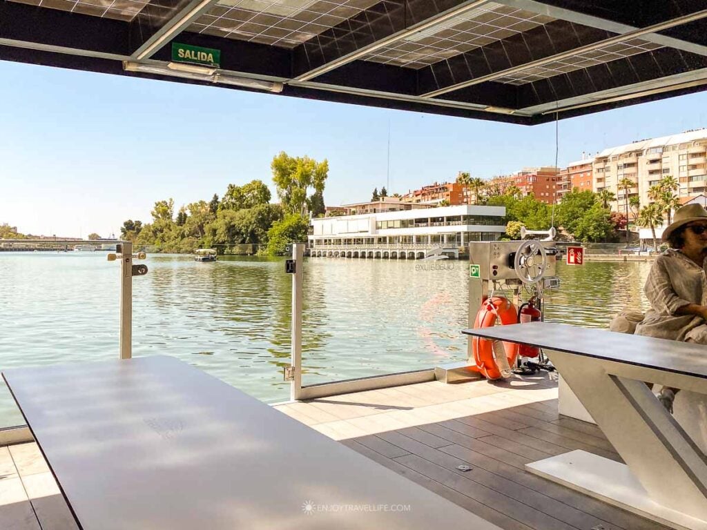 The deck of a solar-powered eco-cruise boat on the Guadalquivir River in Seville, Spain.