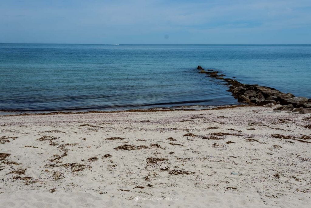 Calm, shallow Nantucket Sound water along the sand at Inkwell Beach in Oak Bluffs, Martha's Vineyard.