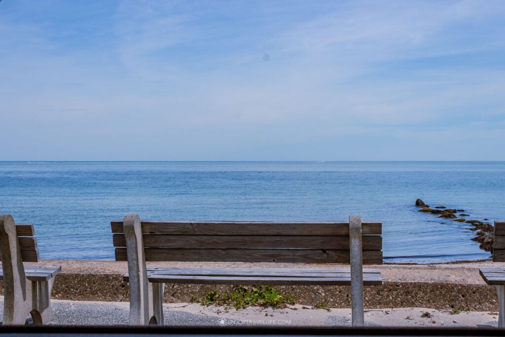 A bench overlooking the water along Seaview Avenue at Inkwell Beach in Oak Bluffs, Martha's Vineyard.