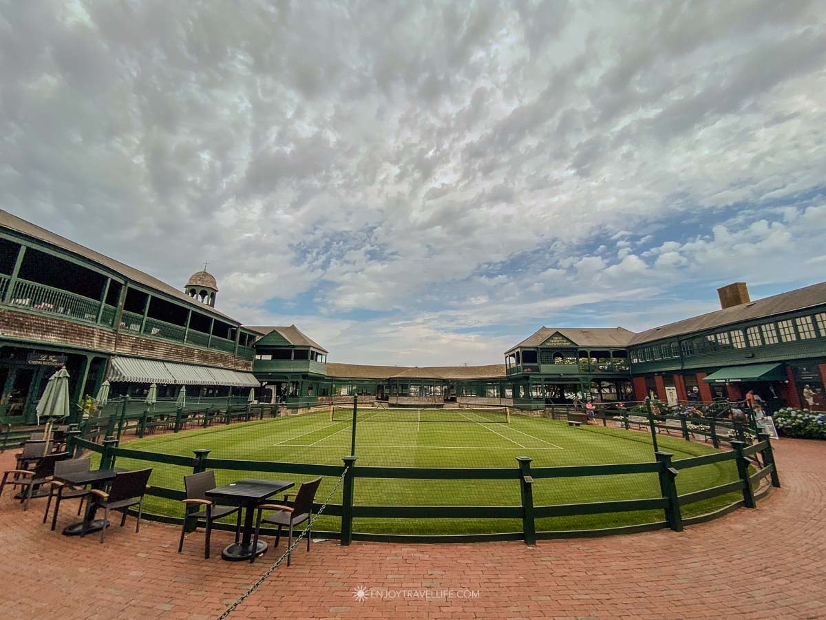 Grass courts stretch before the shingled Newport Casino at the International Tennis Hall of Fame.