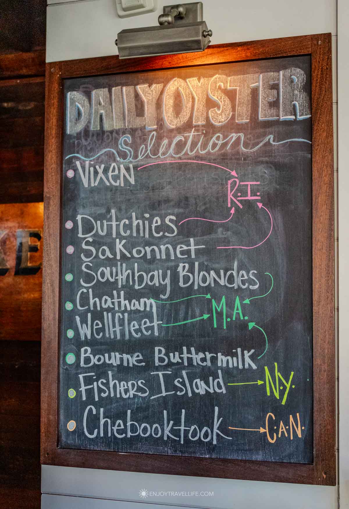 A chalkboard lists the day's oyster selection at Midtown Oyster Bar on Newport's Thames Street.