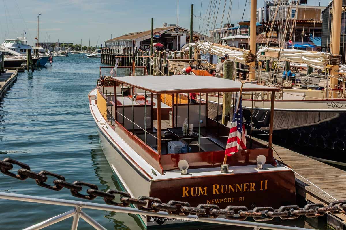 Classic wooden boats line the docks at Bowen's Wharf in Newport Harbor.