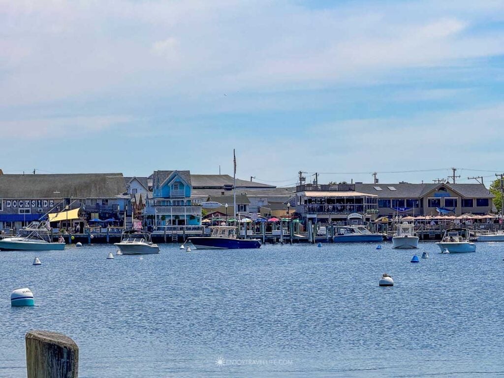 Oak Bluffs harbor lined with boats and waterfront buildings on Martha's Vineyard.