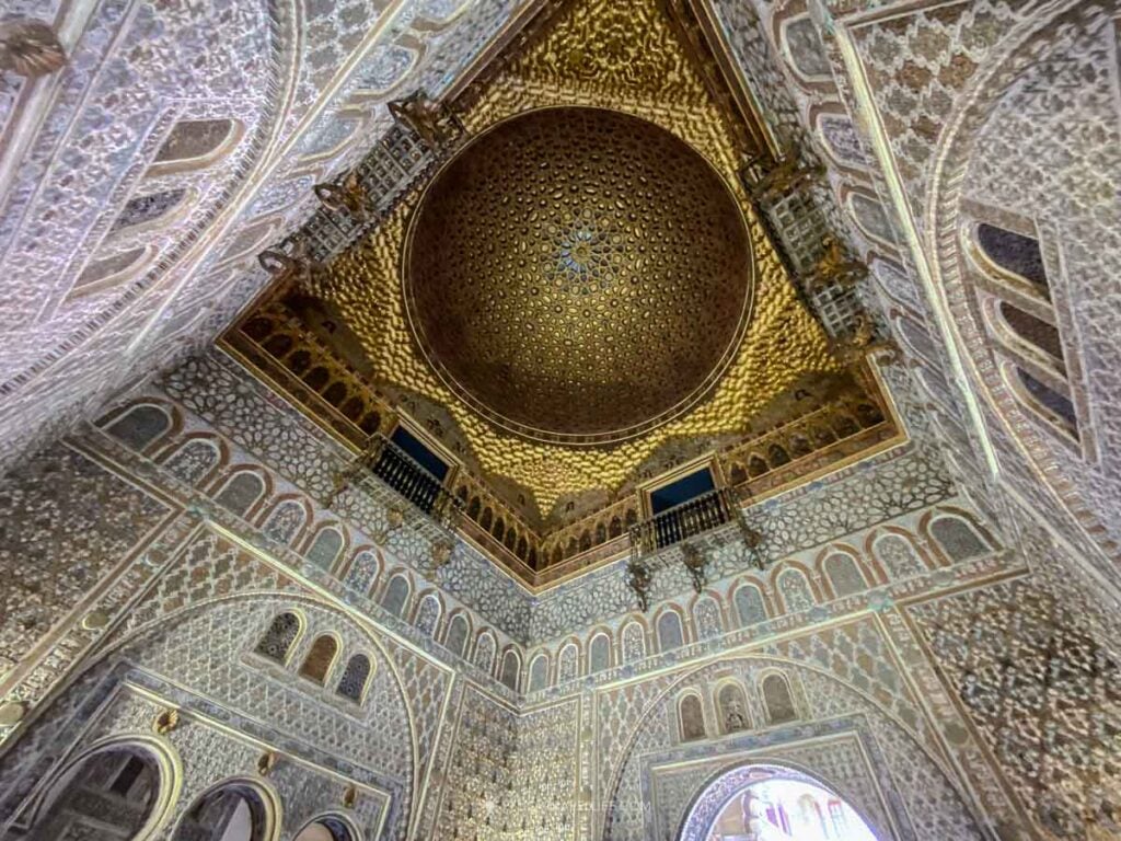 The gilded domed ceiling of the Ambassadors' Hall in the Real Alcázar of Seville, Spain.