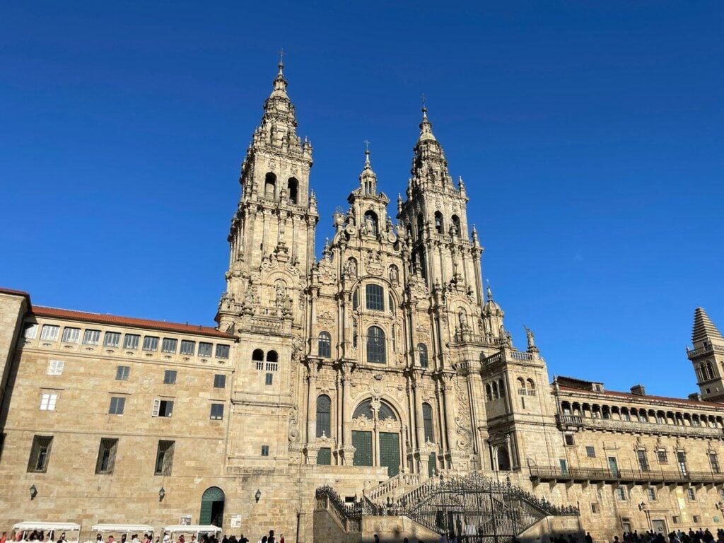 The Santiago de Compostela Cathedral rises under a clear sky at the end of the Camino de Santiago.