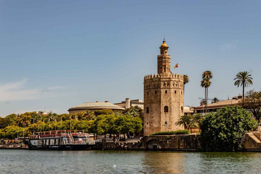 The Torre del Oro watchtower on the bank of the Guadalquivir River in Seville, Spain.