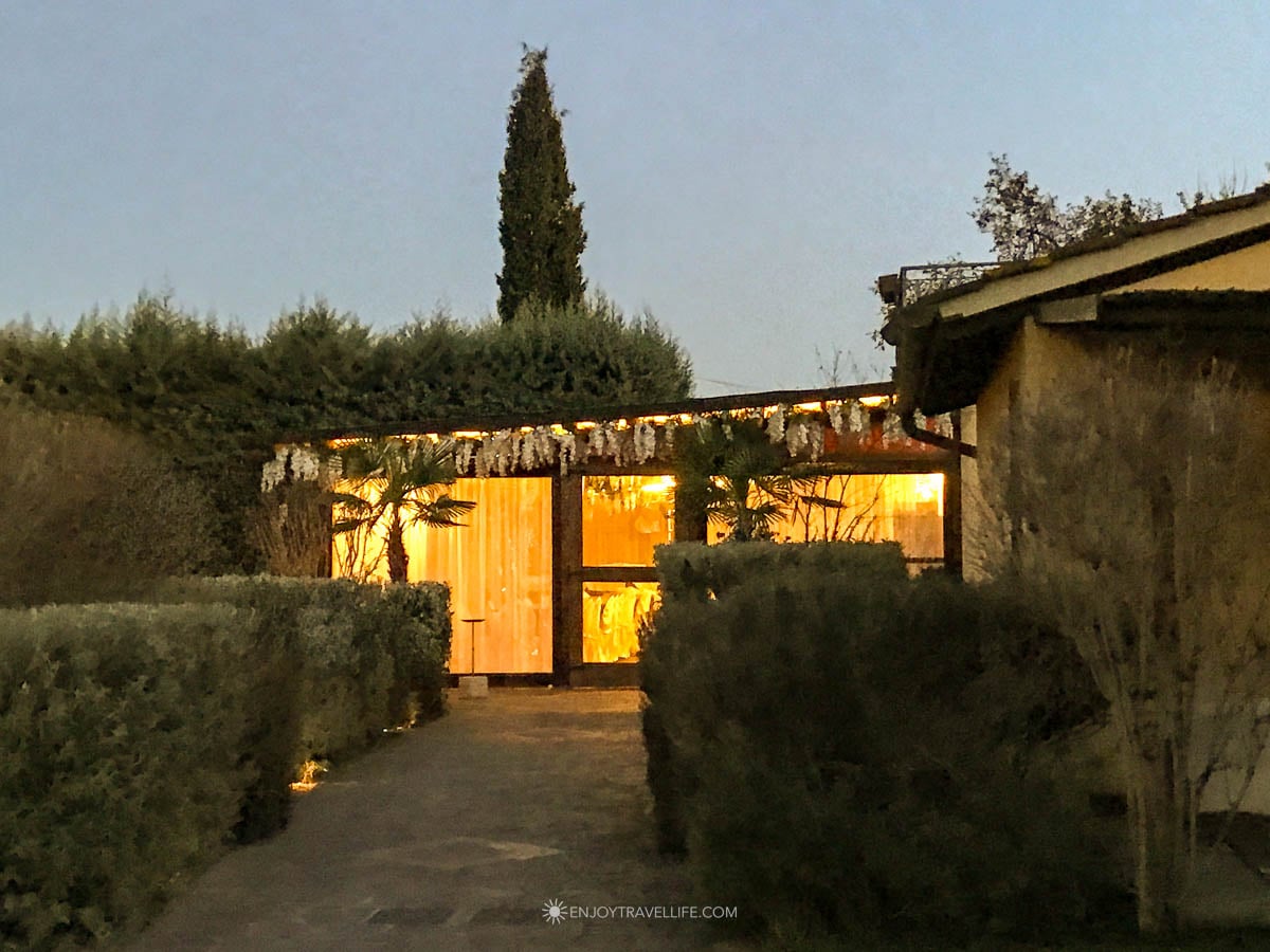 Tenuta Torciano winery estate illuminated at dusk with cypress trees and golden light