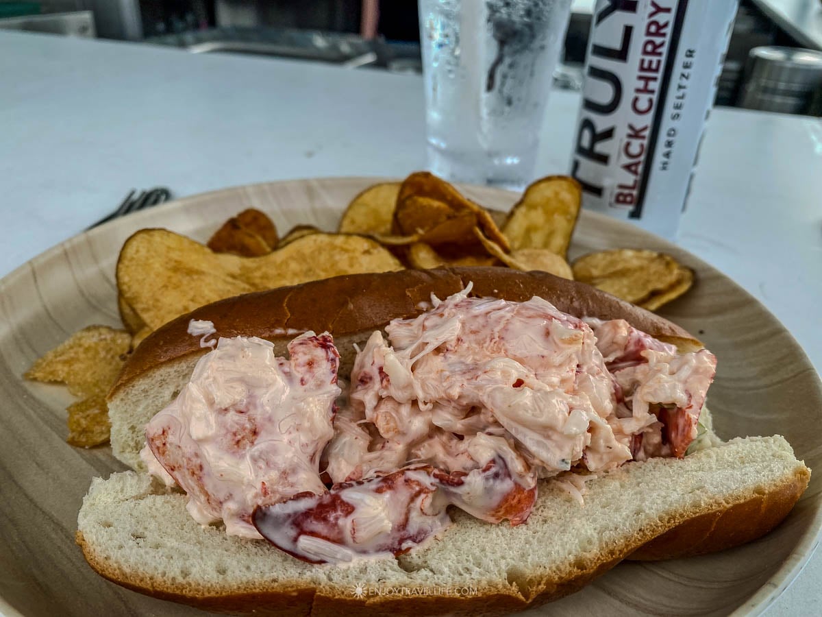 A loaded lobster roll with chips is served at Top of Newport above Bellevue Avenue.