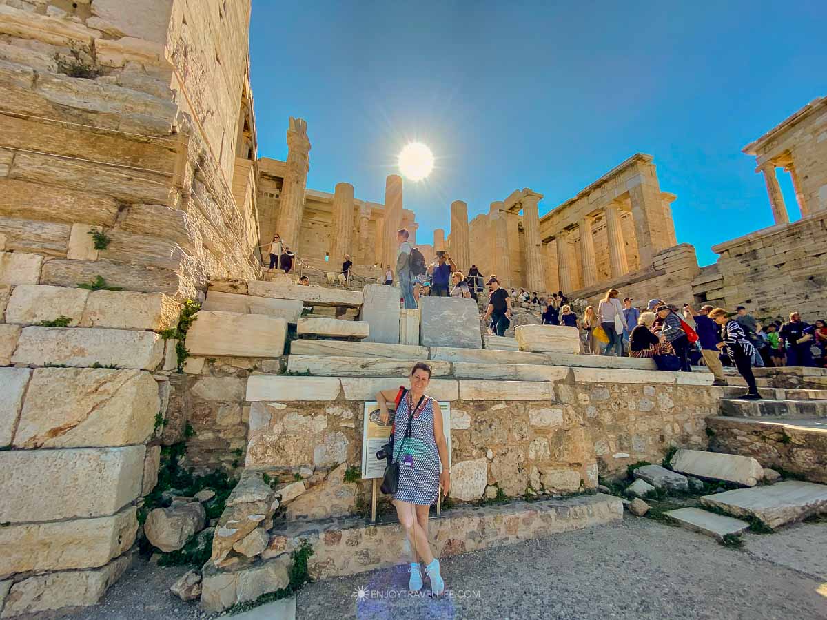 Jackie Gately stands below the Propylaea gateway on the Acropolis in Athens, Greece.