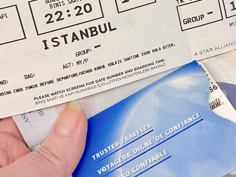 A Turkish Airlines boarding pass to Istanbul resting on a Global Entry Trusted Traveler card