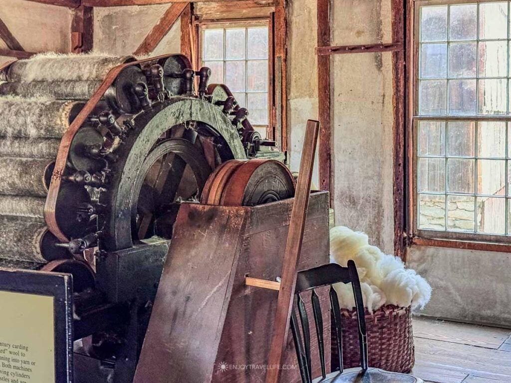 The water-powered carding machine prepares fleece at the carding mill.