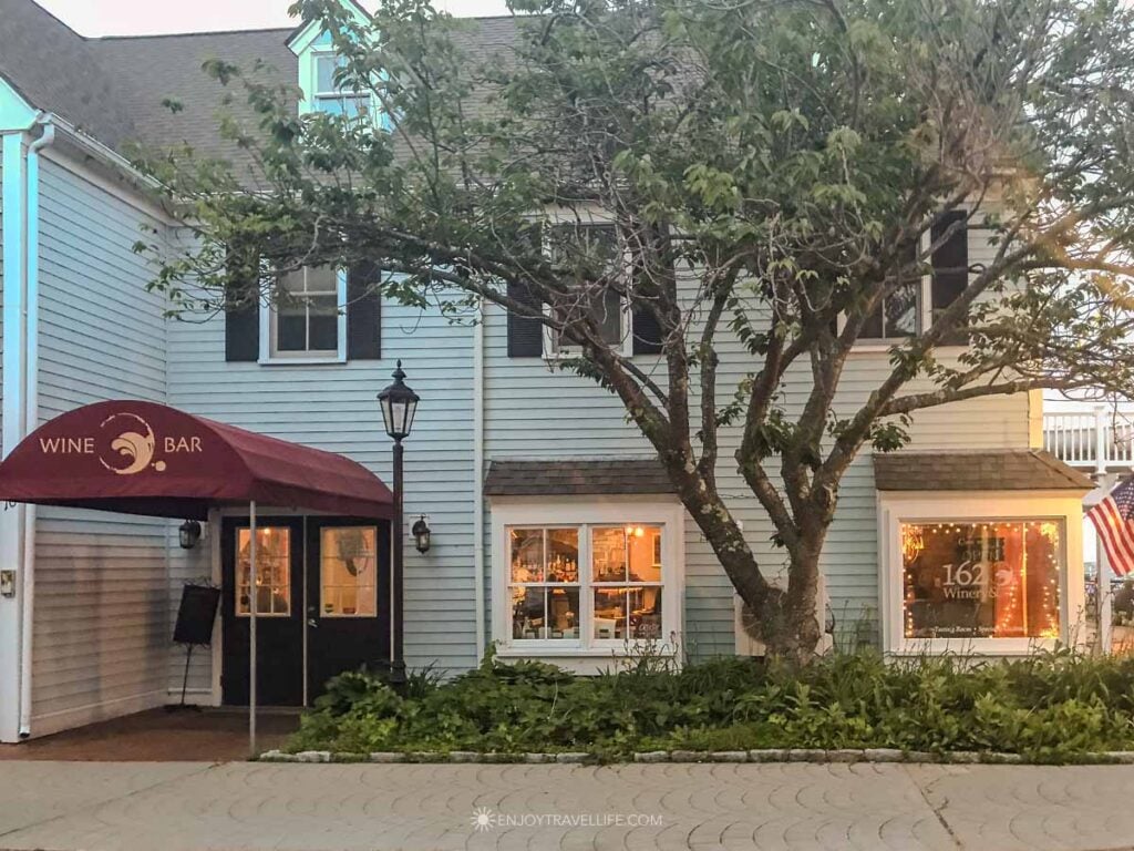 A burgundy awning marks the entrance to the 1620 Wine Bar at Village Landing Marketplace in Plymouth.