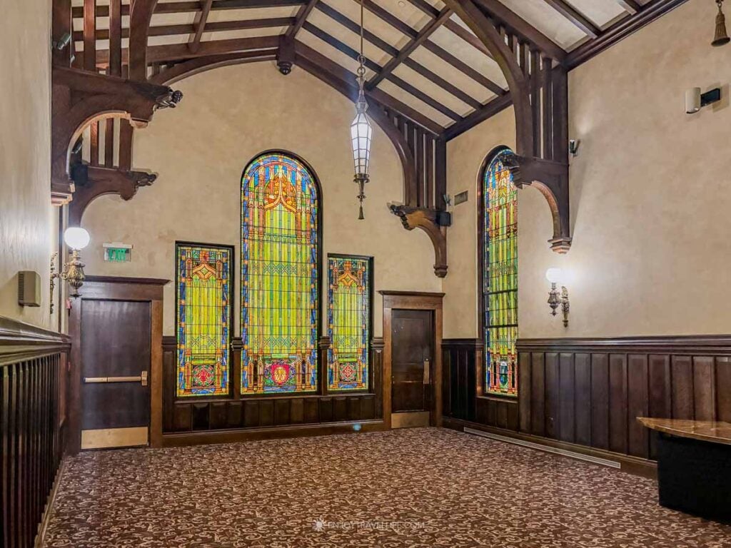 Stained-glass windows and timbered ceiling in the Beechwood Hotel’s Maria Gill Wilson Chapel.