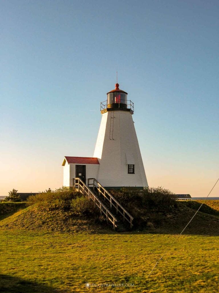 Plymouth Light, also known as Gurnet Light, rises above a wooden stairway on a grassy mound at Gurnet Point.