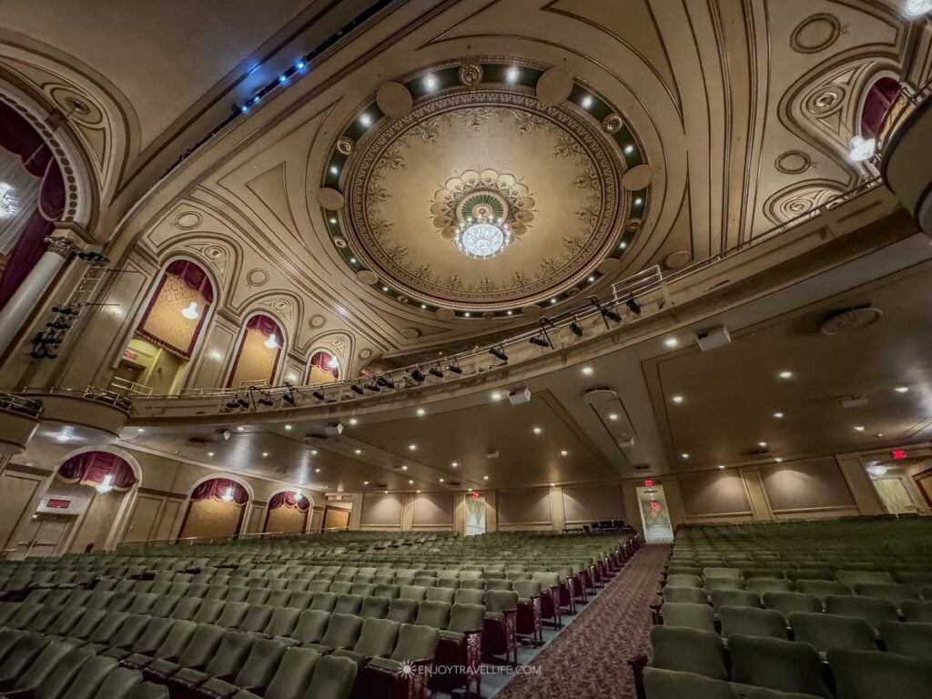 Gold and crimson auditorium of the Hanover Theatre in Worcester under its painted dome.