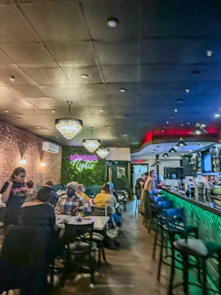 Narrow dining room and bar at Havana Nights restaurant in Worcester.