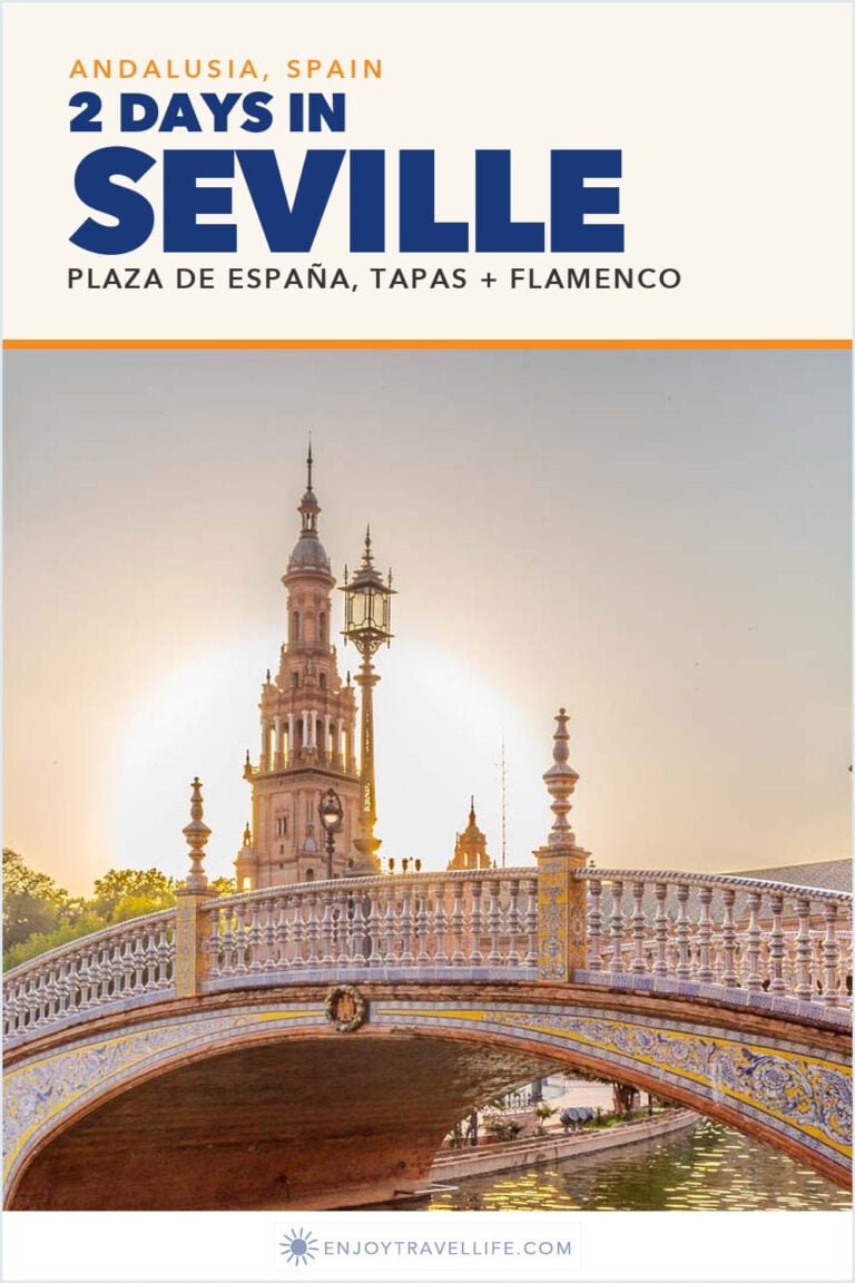 The tiled bridge and tower of Plaza de España in Seville, Spain, at sunset.