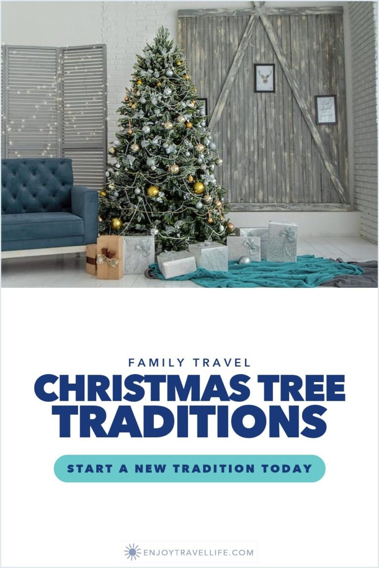 A decorated Christmas tree beside a blue sofa with wrapped gifts underneath in a bright living room.