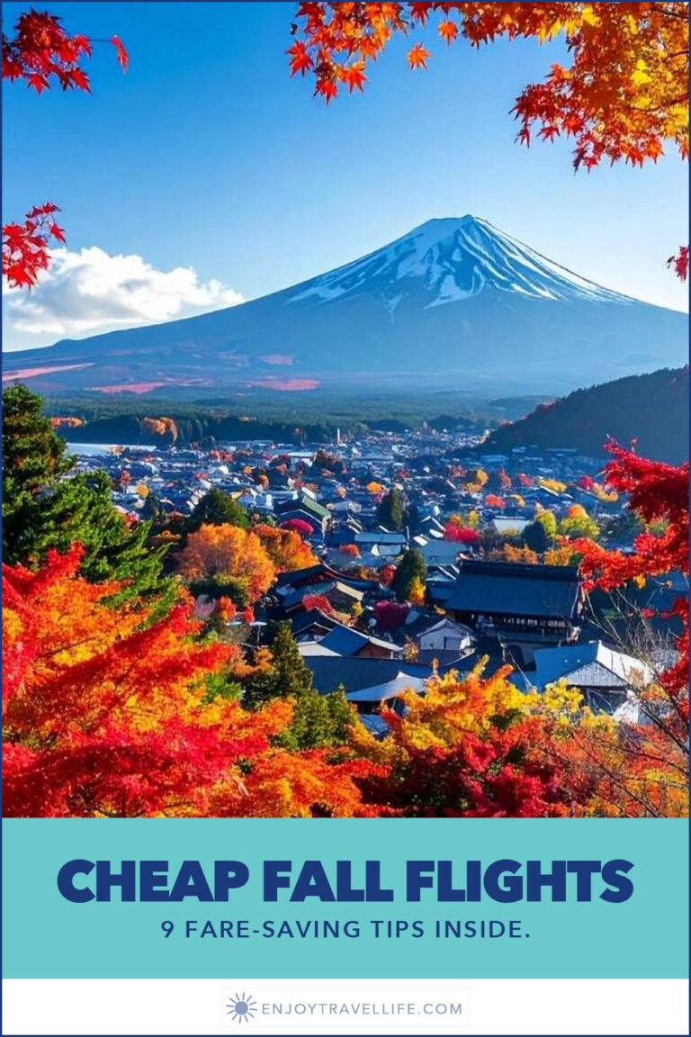 Mount Fuji framed by red maple leaves.