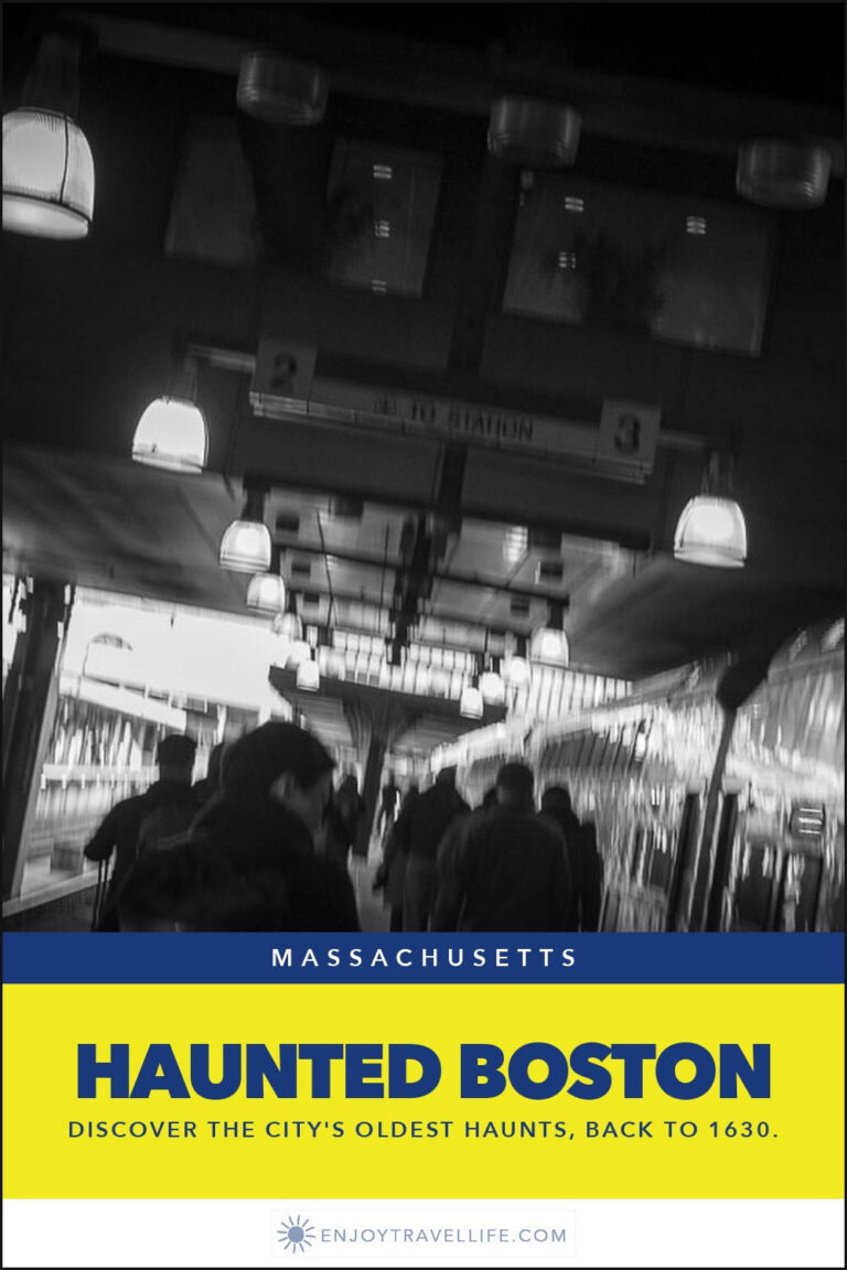 A dim tunnel crowded with people during a haunted tour in Boston.