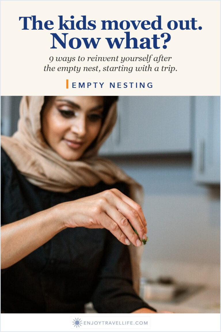 A woman seasons a dish in a kitchen.