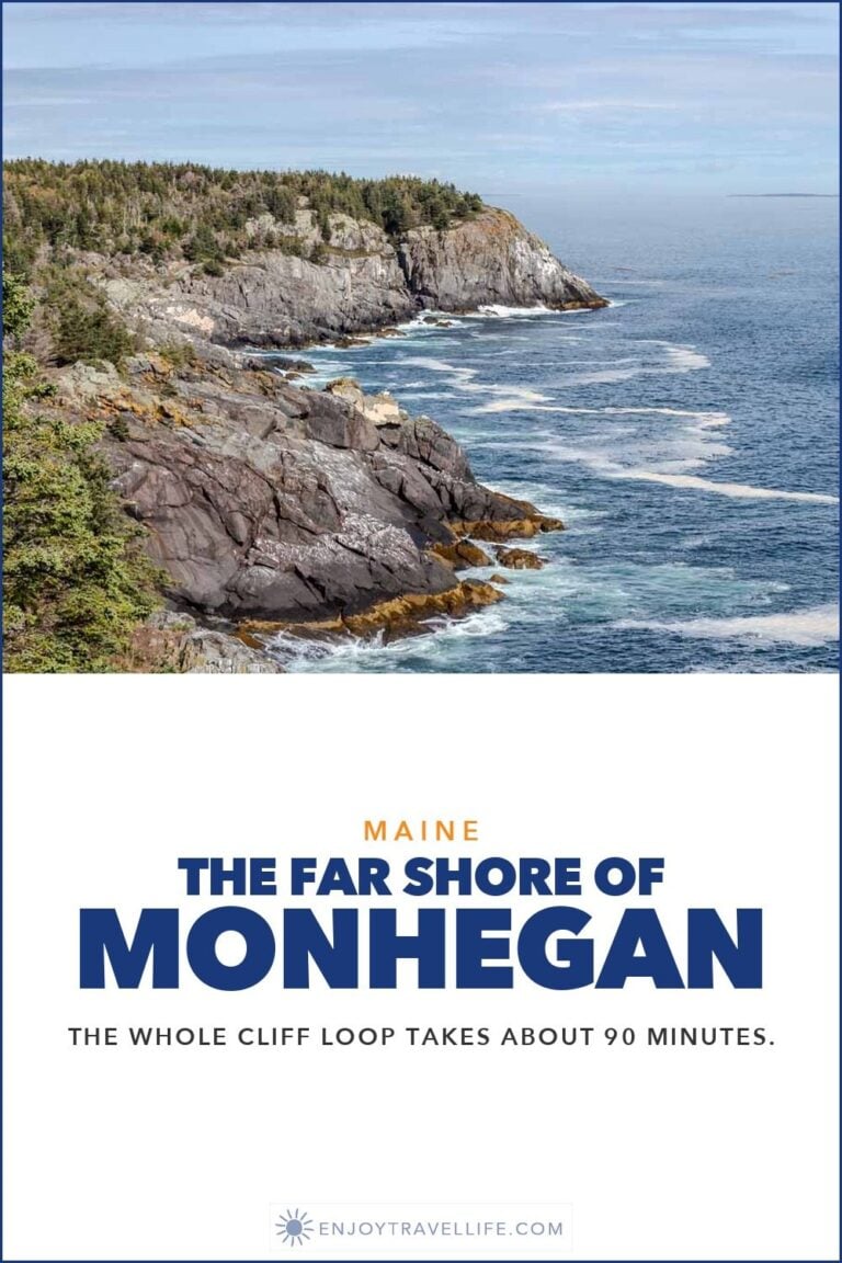 Spruce-covered granite cliffs drop into the Atlantic on the far shore of Monhegan Island, Maine.