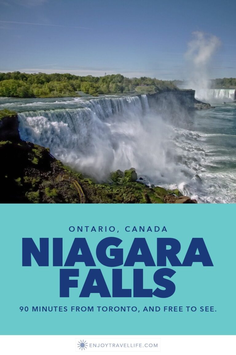 The American Falls at Niagara seen from above, with mist rising over the river gorge.