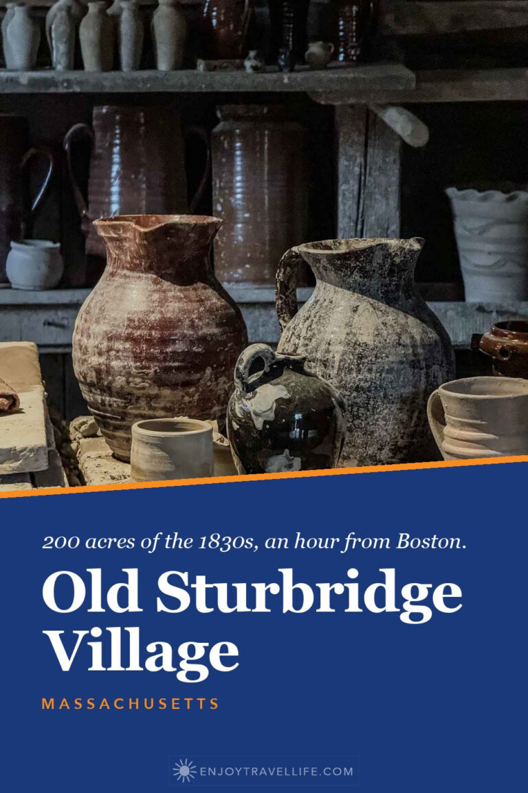 Redware jugs and pottery on the shelves of the potter's shop at Old Sturbridge Village, Massachusetts.