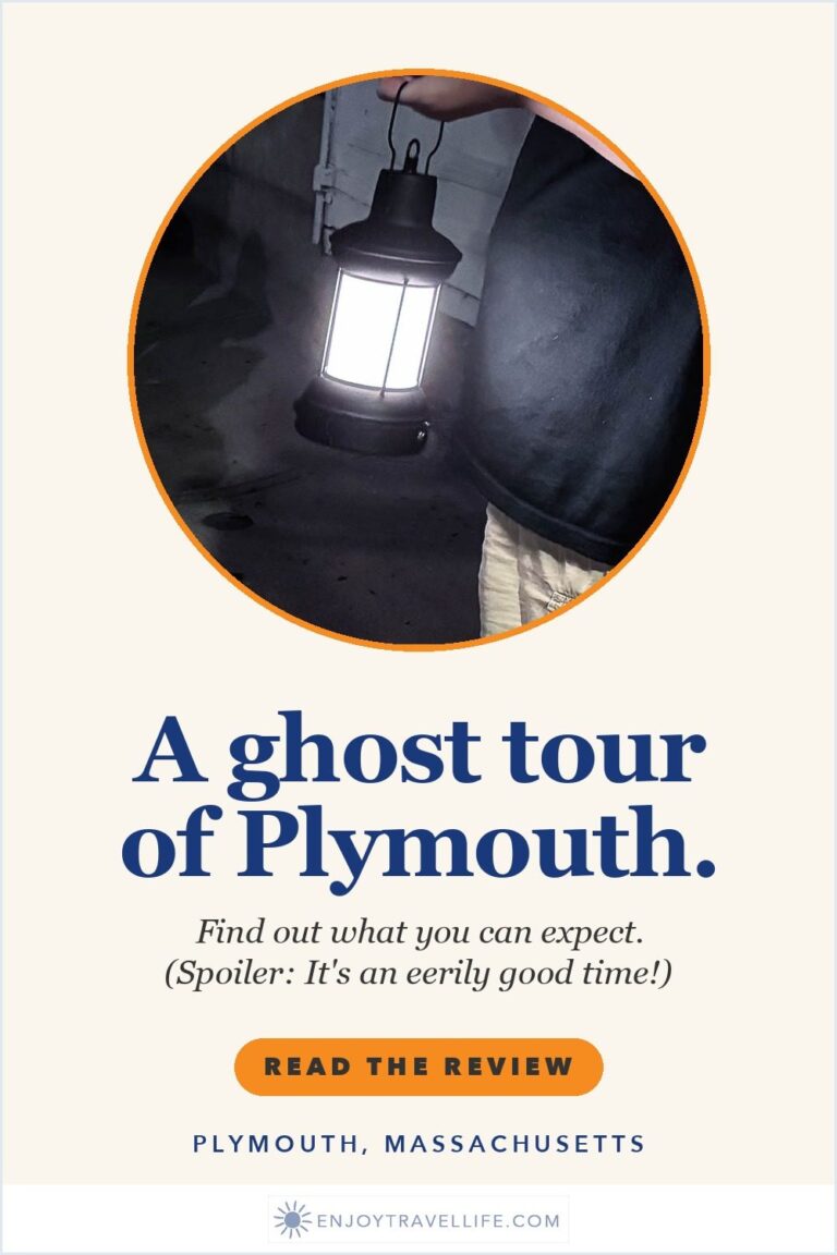 A lit lantern carried along a dark street on a ghost tour in Plymouth, Massachusetts.