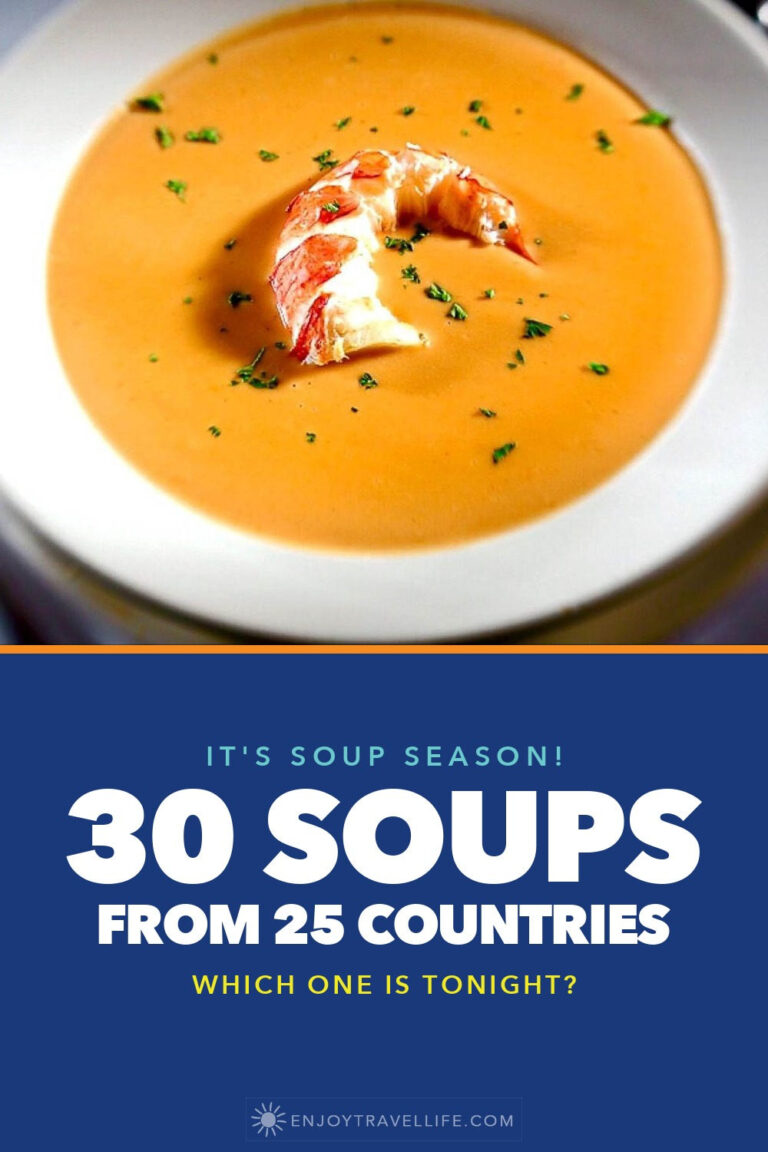 A bowl of lobster bisque garnished with lobster meat.