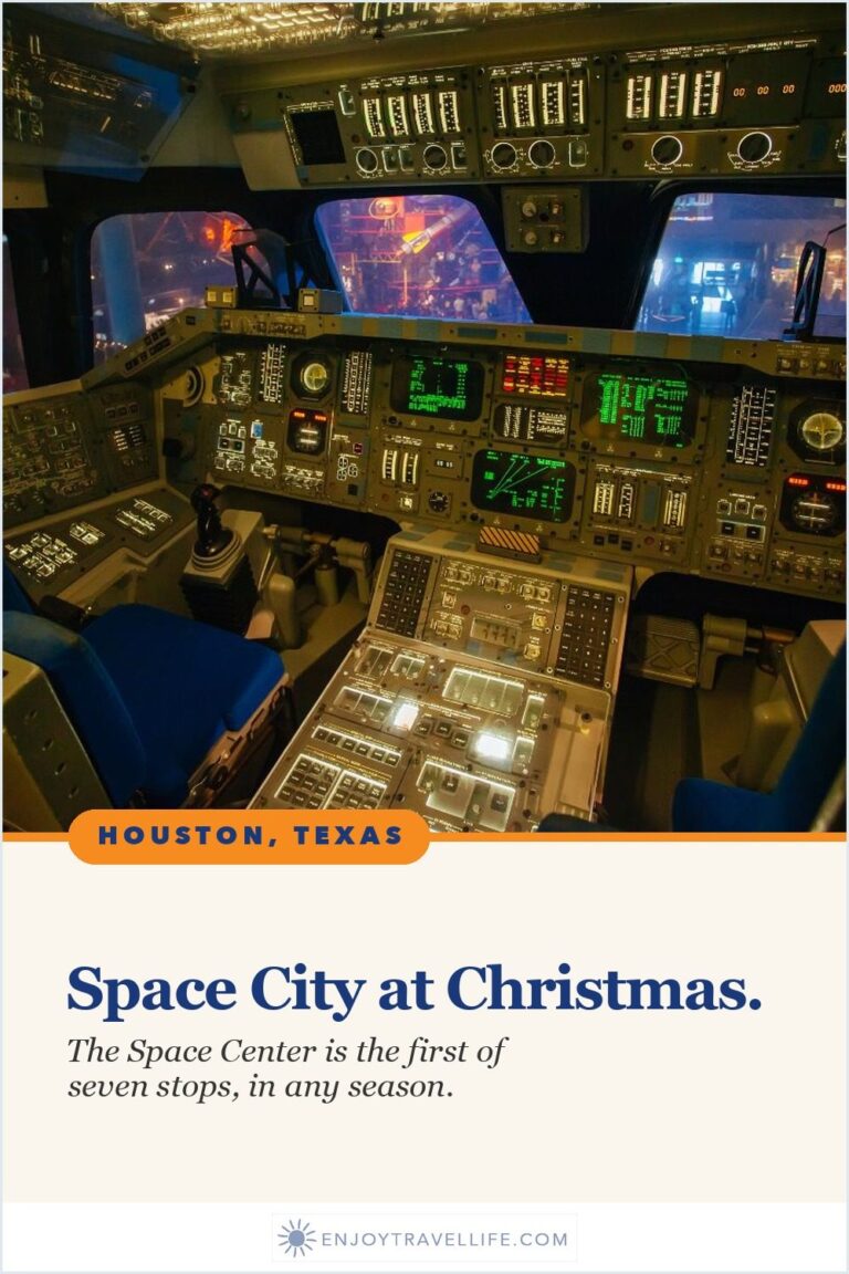 The cockpit of a space shuttle with rows of control panels at Space Center Houston, Texas.