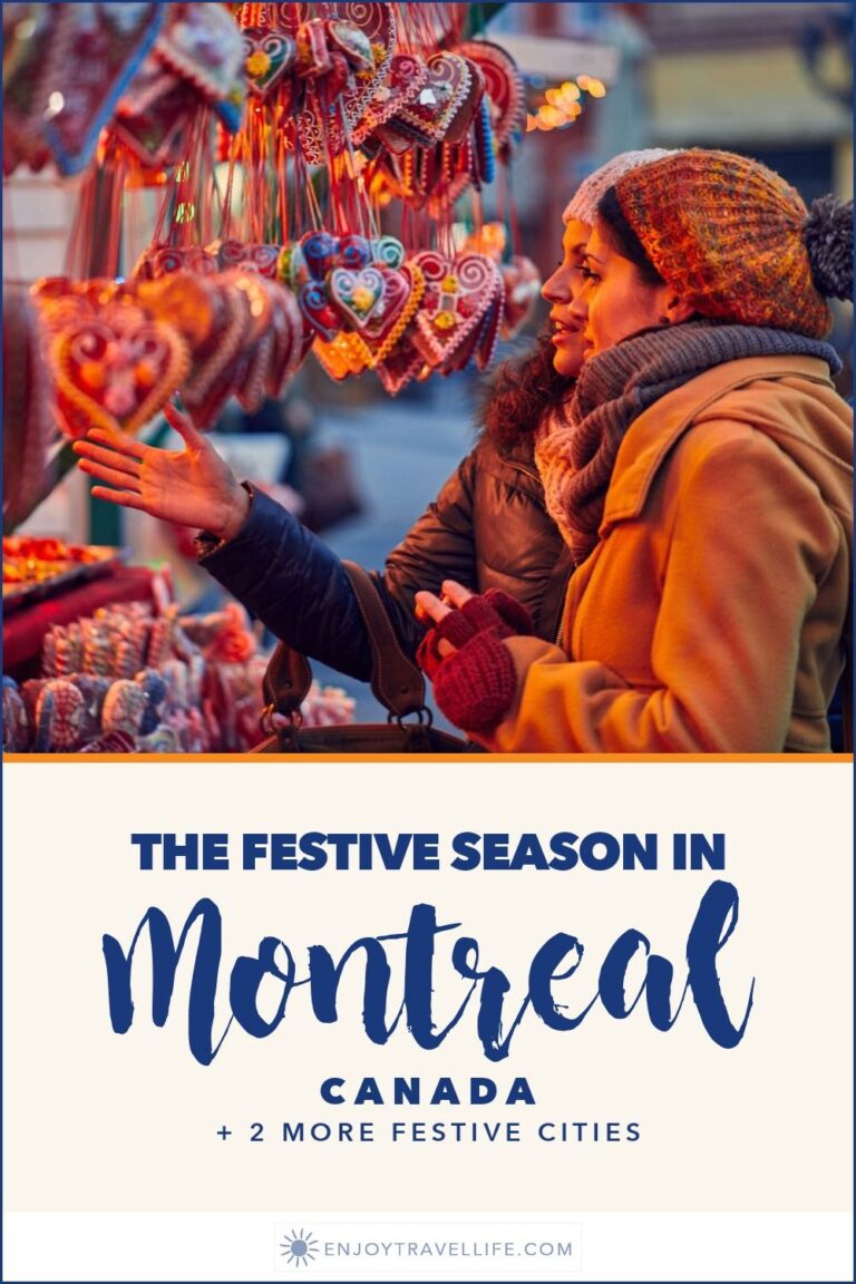 A woman browsing gingerbread hearts at a Christmas market stall in Montreal, Canada.