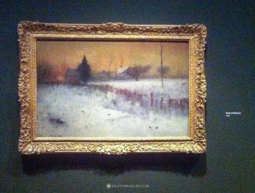 George Inness's Home at Montclair, an 1892 winter landscape in a gilt frame, on the wall at the Clark Art Institute in Williamstown.