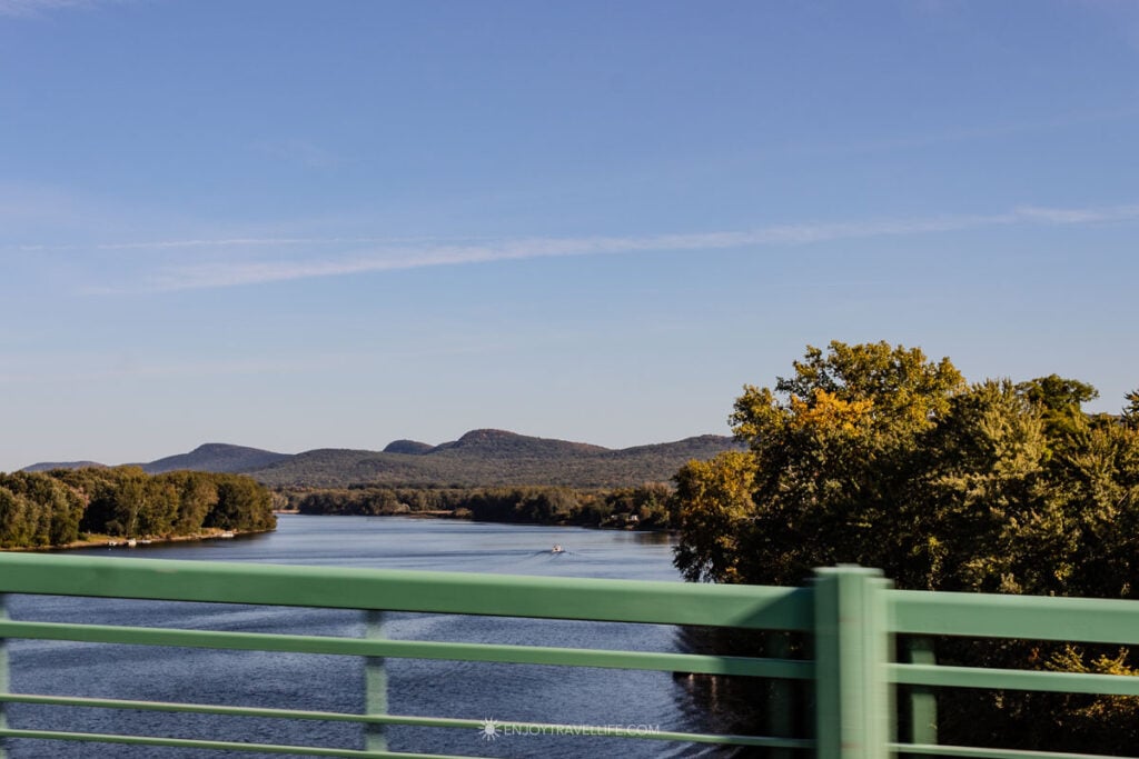 The Connecticut River and the Holyoke Range from the Route 9 bridge with the first fall color showing.
