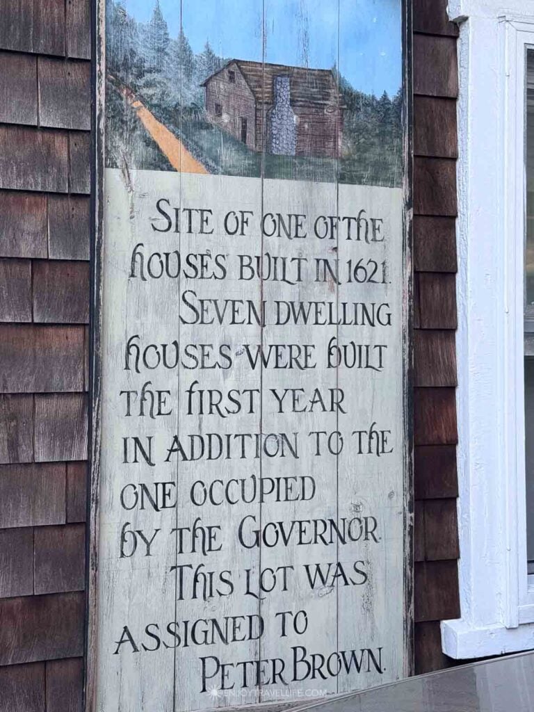A painted sign in Plymouth marks the site of a 1621 house lot assigned to Peter Brown.