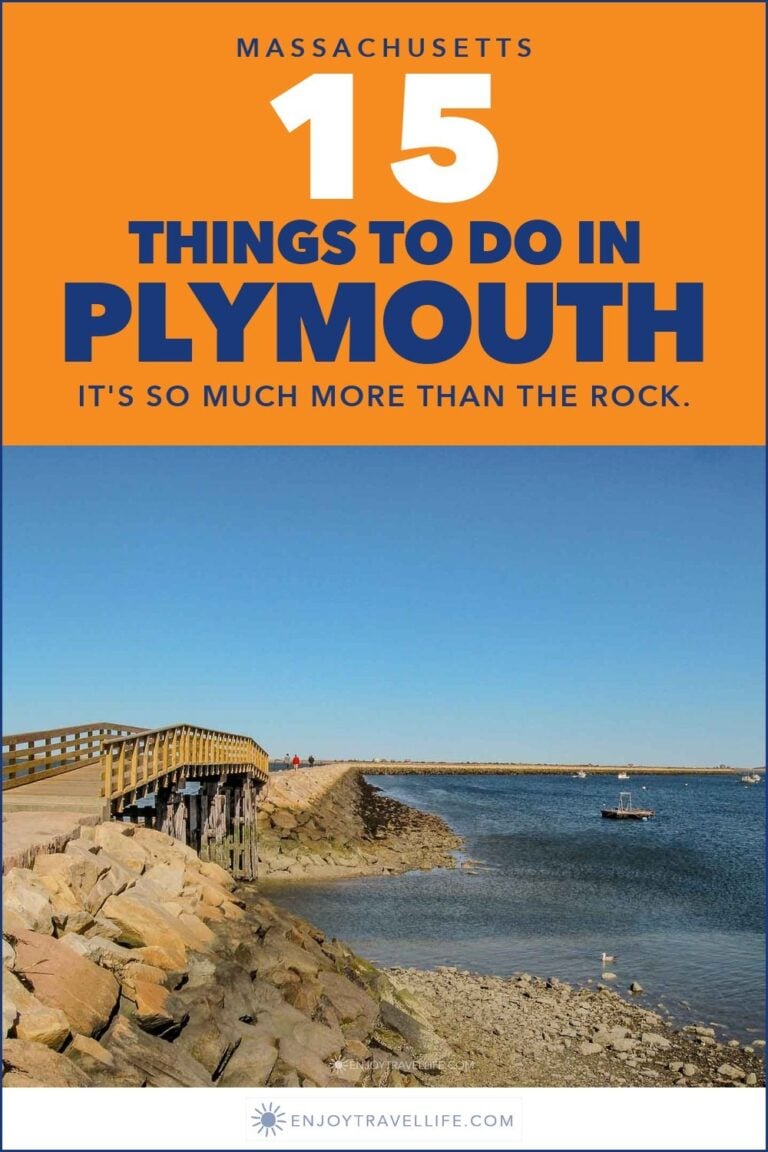 A wooden footbridge leading out along the rock jetty into Plymouth Harbor, Massachusetts.