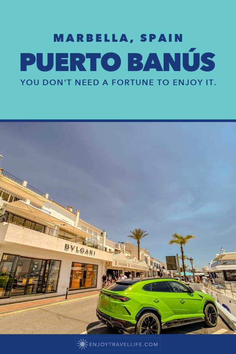 A green sports car parked by the Bulgari boutique and the yachts at the marina in Puerto Banús, Marbella, Spain.