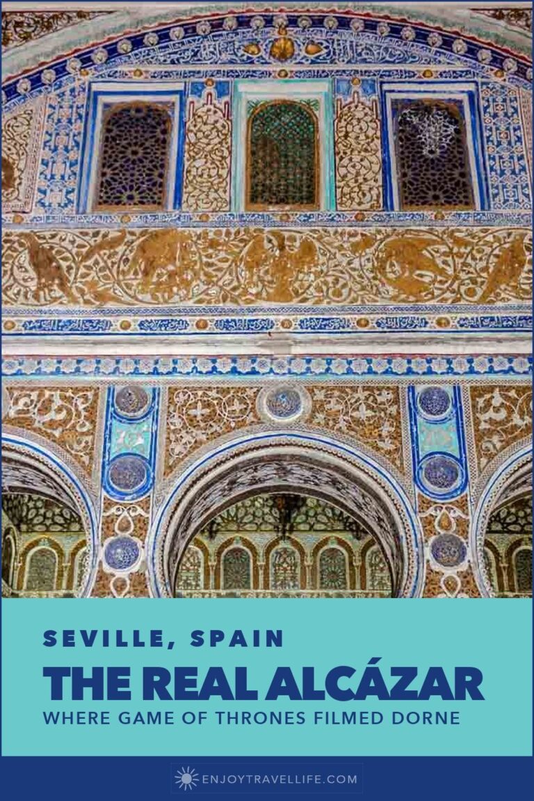 Ornate Mudéjar tilework and arches inside the Real Alcázar in Seville, Spain.
