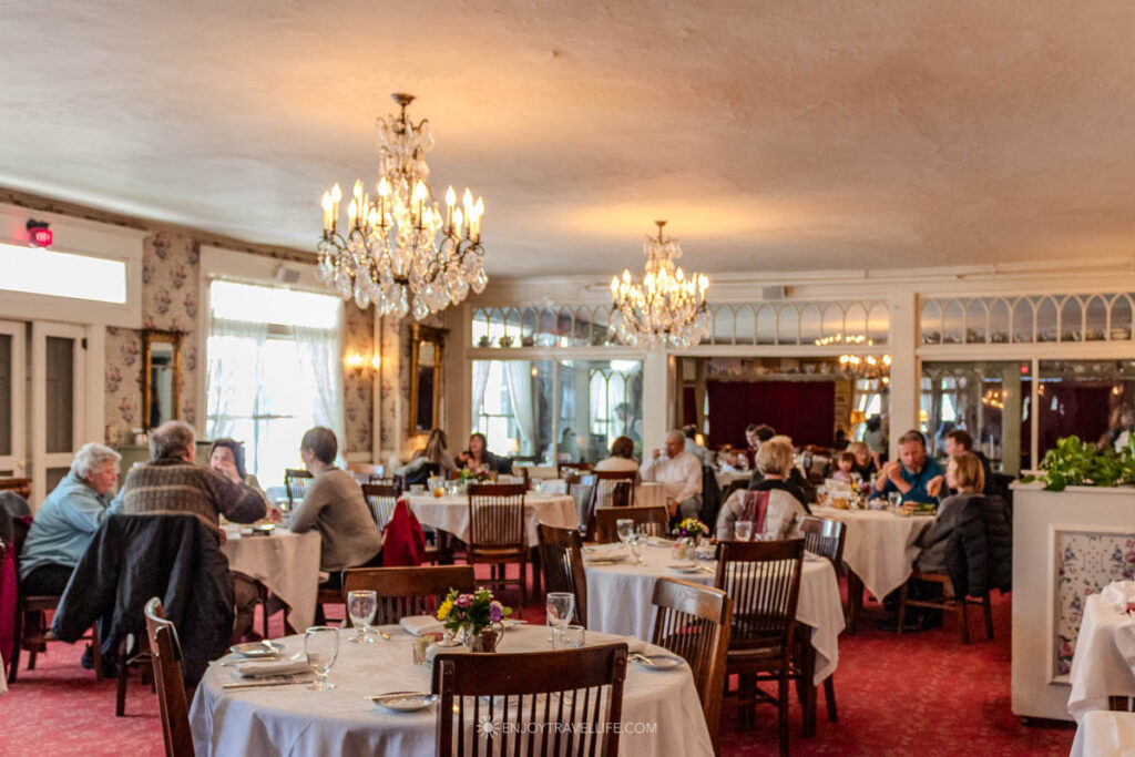 White tablecloths and chandeliers in the main dining room at the Red Lion Inn in Stockbridge.